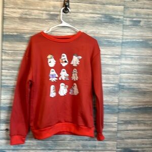 Halloween theme sweatshirt with ghosts reading books